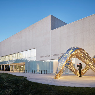 Image of the exterior of a community cultural center with fantastic lighting completed by AKLD Lighting Design