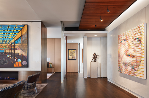 The High-Rise Home Chicago, interior lighting living room and hallway lined with artwork